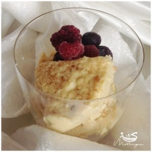 a bowl of Guyanese baked custard topped with berries