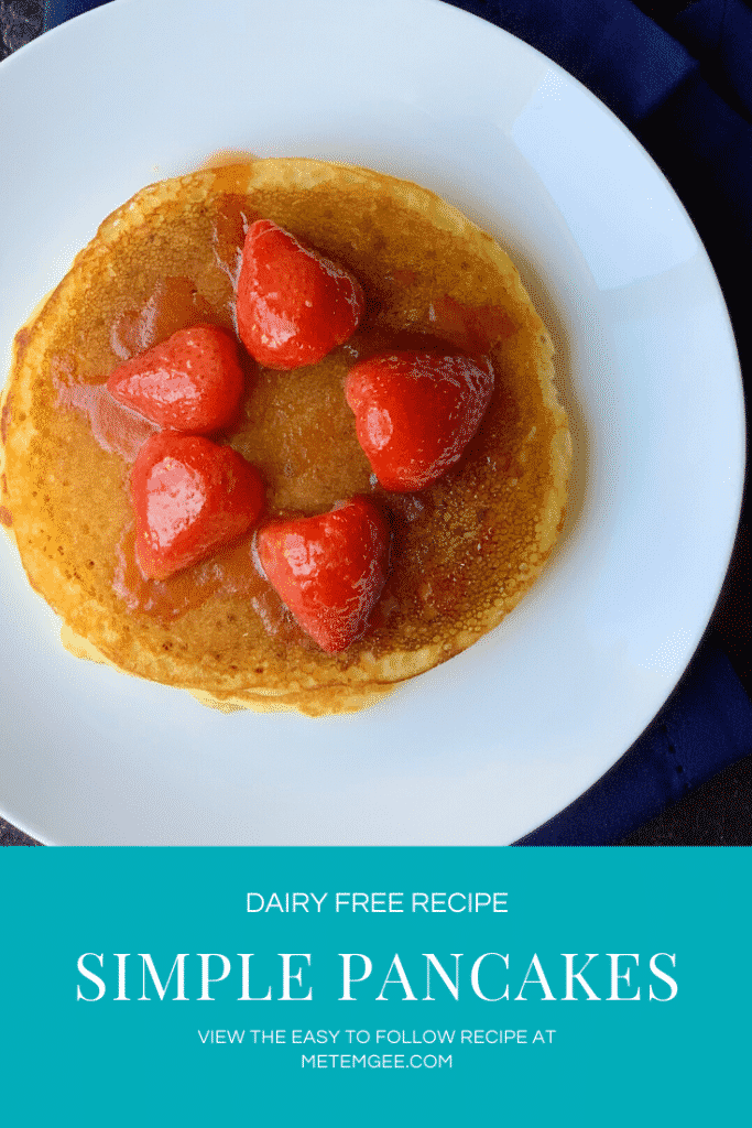 plated pancake topped with berry sauce