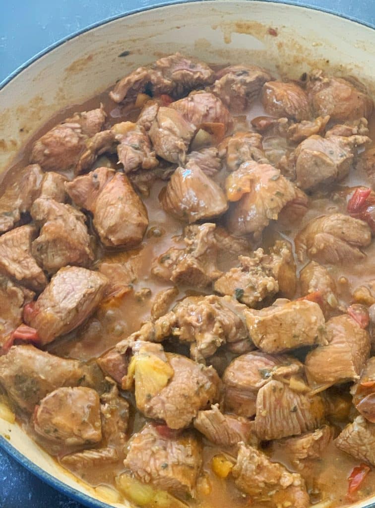 lamb stew simmering in a pot