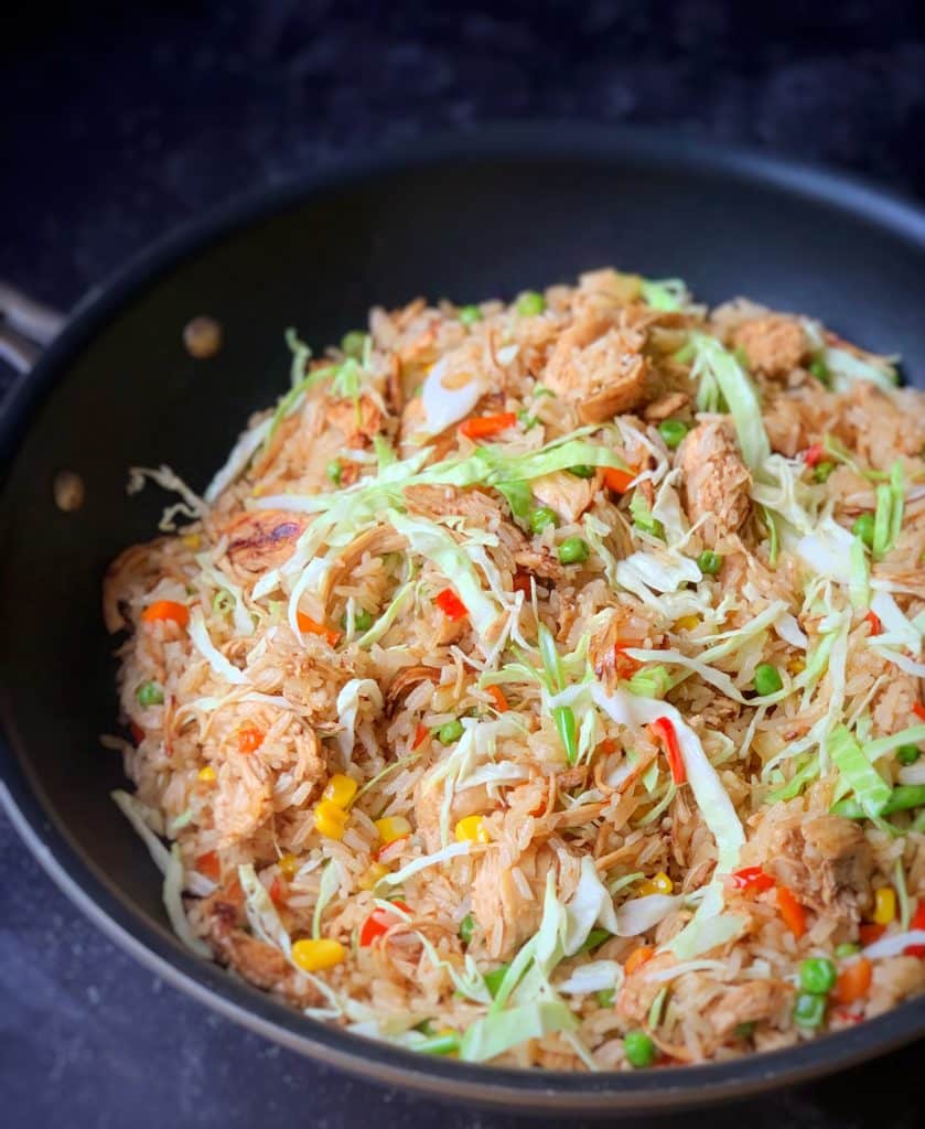 close up view of Stripped Chicken Fried Rice in a skillet