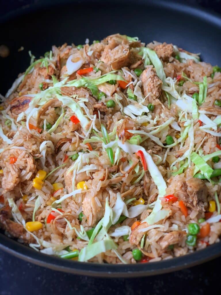 close up view of chicken fried rice in a skillet