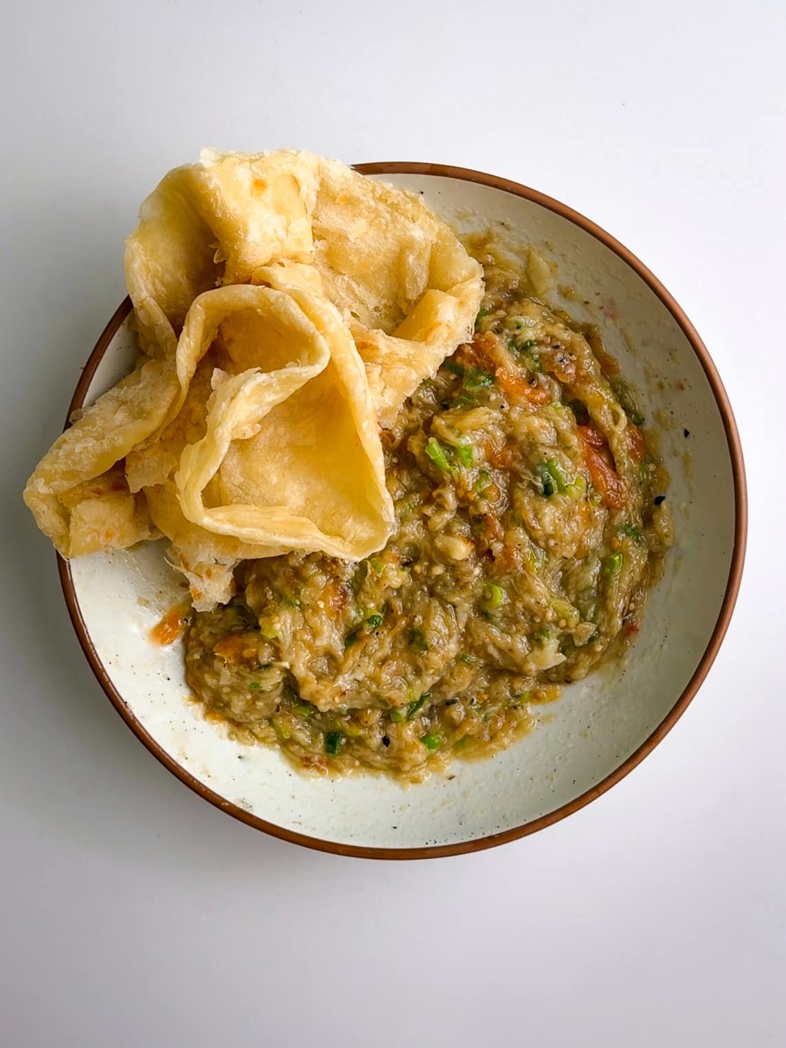 Guyanese Baigan Choka and oil roti.