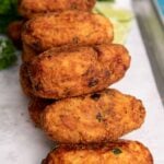 Crispy saltfish cakes served Guyanese style with croquette shape.