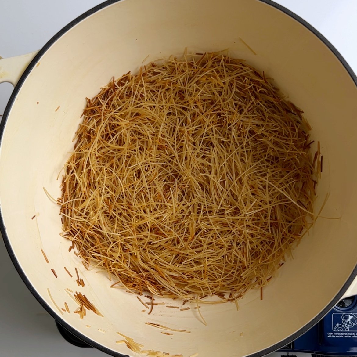 toasted vermicelli in a cream dutch oven