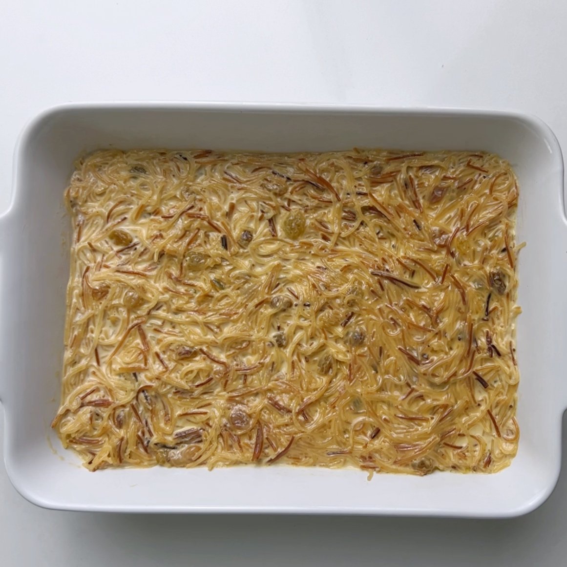 vermicelli cake in a white rectangular casserole dish