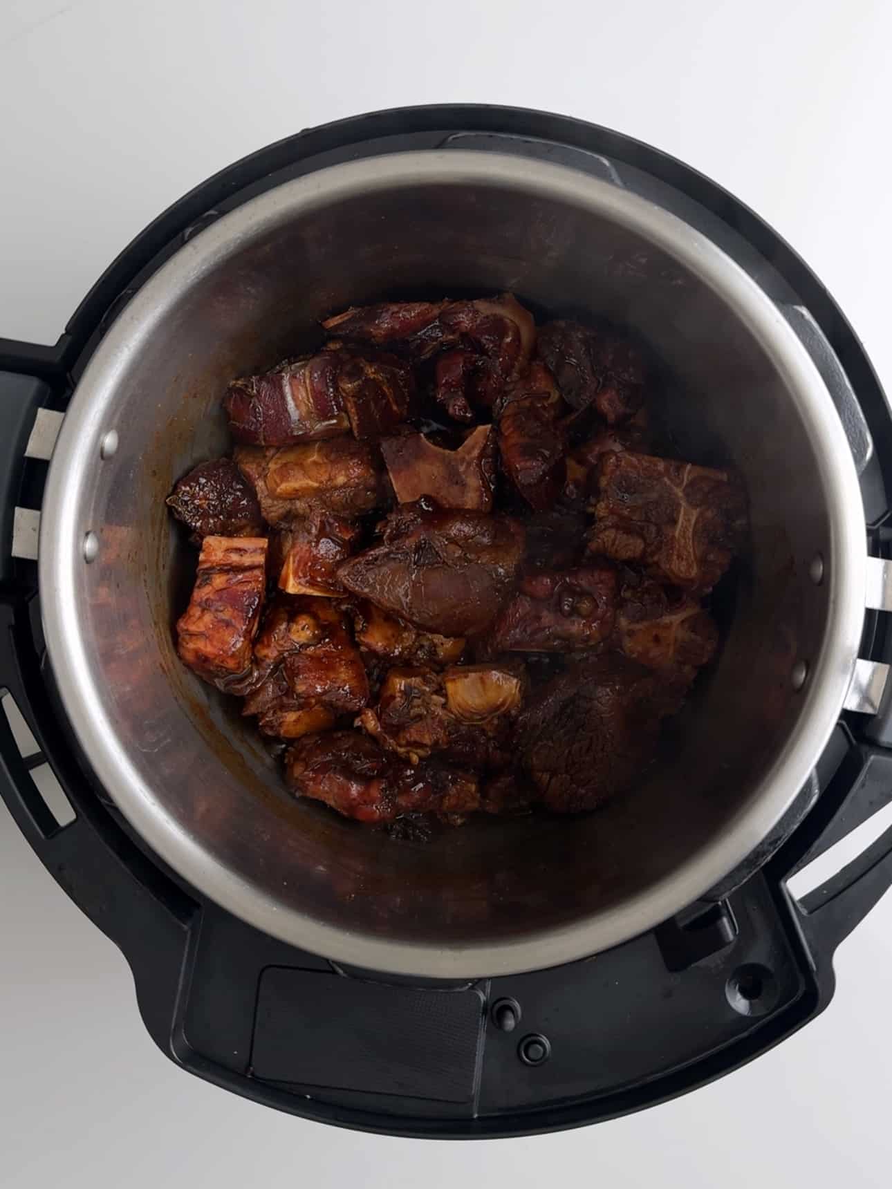 Oxtail in an instant pot waiting to be cooked for pepperpot