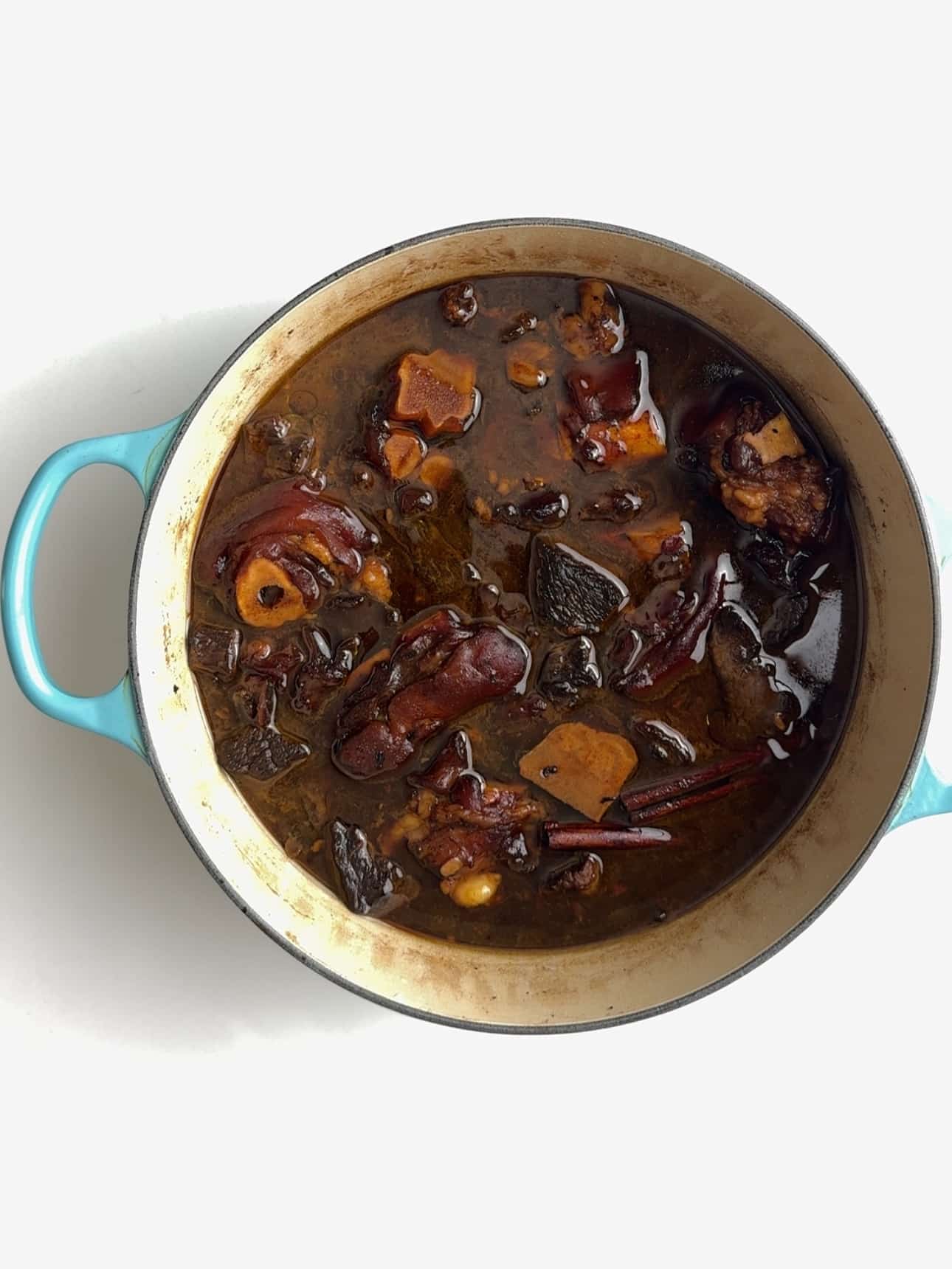 All of the meat for pepperpot in a stock pot