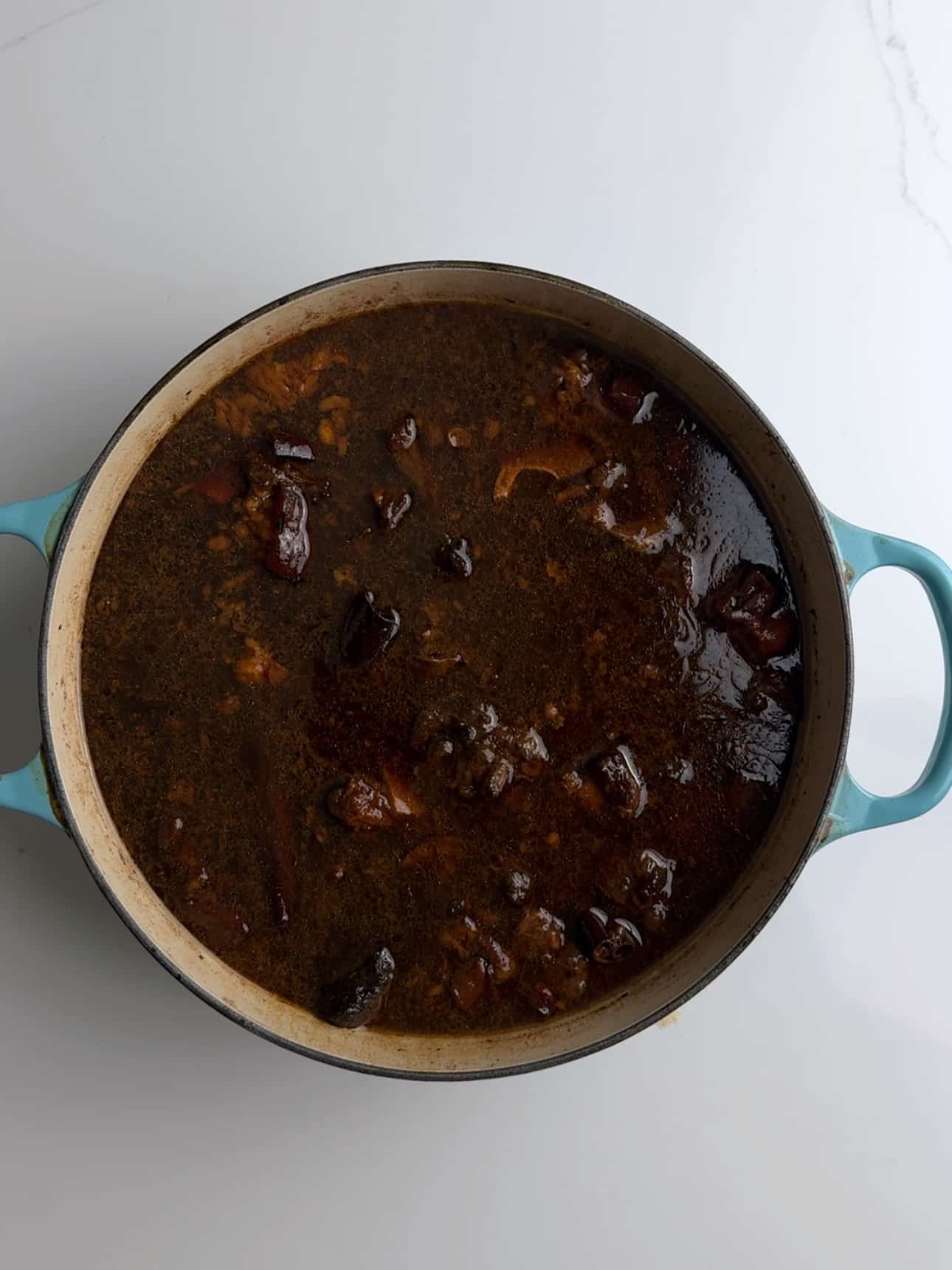 Pepperpot in a blue cast iron dutch oven