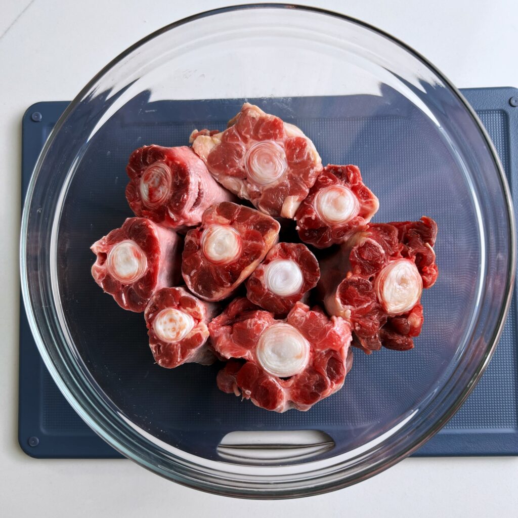 Oxtail bones in a glass bowl