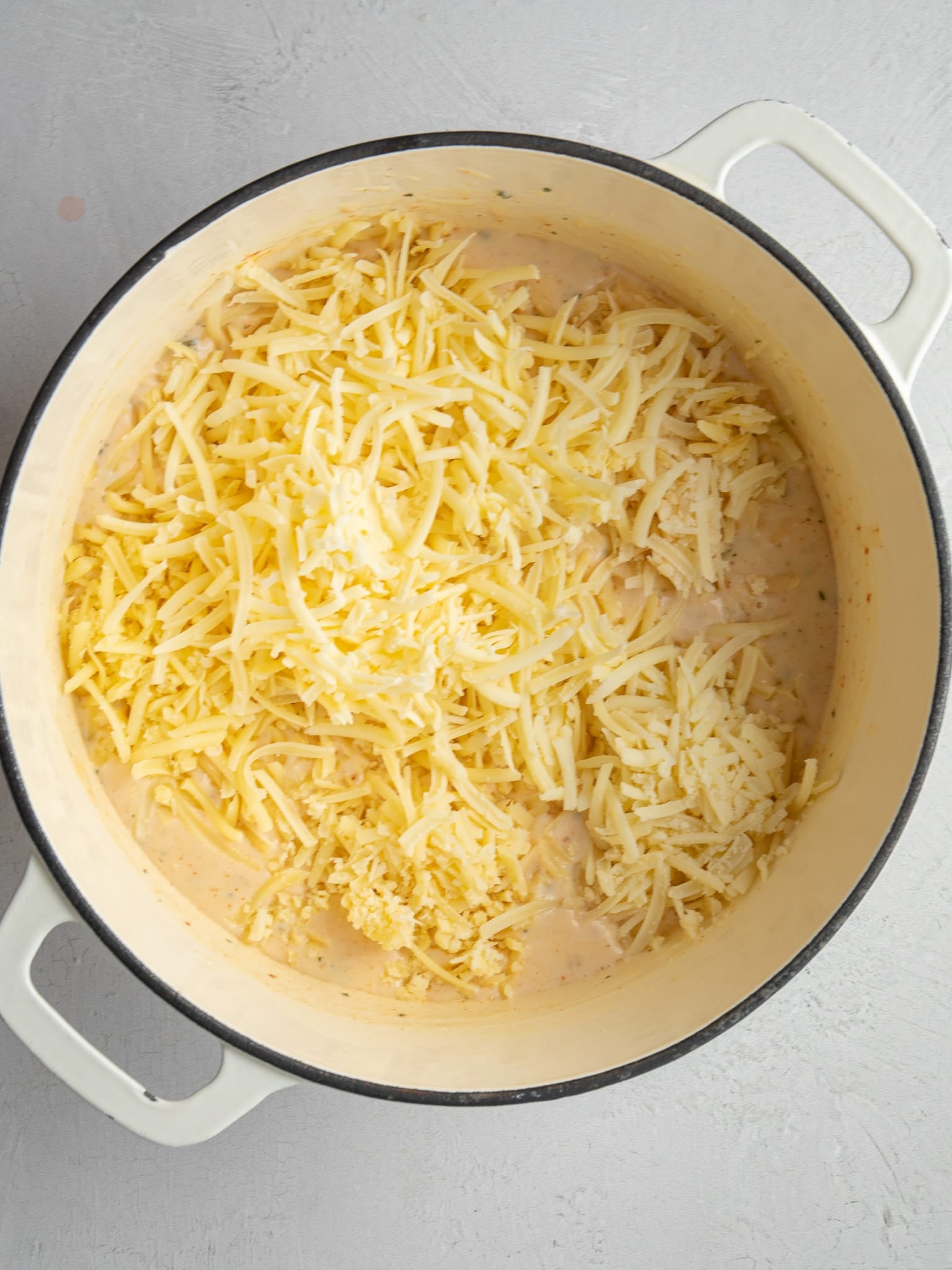 Shredded cheddar, gouda, gruyère, asiago and parmesan added to the sauce