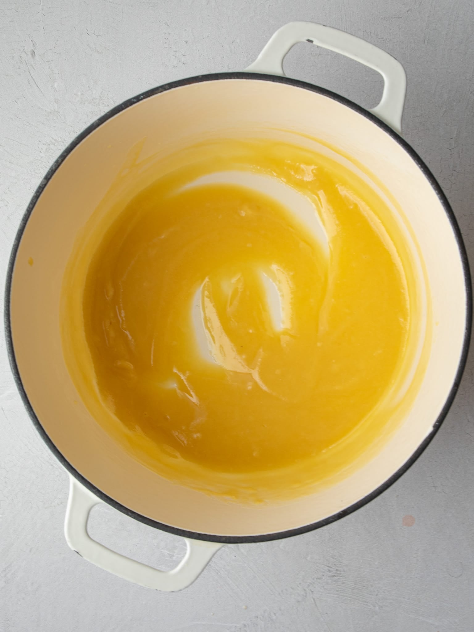 Golden butter and flour roux cooked in a cream enameled cast iron pot for 5 cheese mac and cheese.