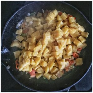plantains added to a skillet to make home fries