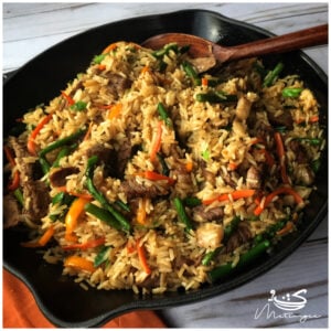 steak fried rice in a cast iron skillet