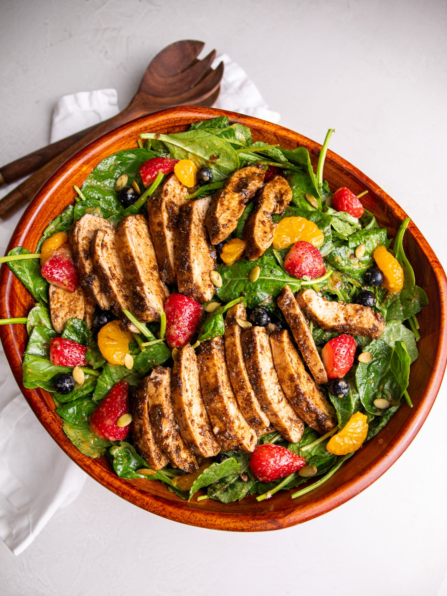 jerk chicken salad with berries and caramelized onion dressing