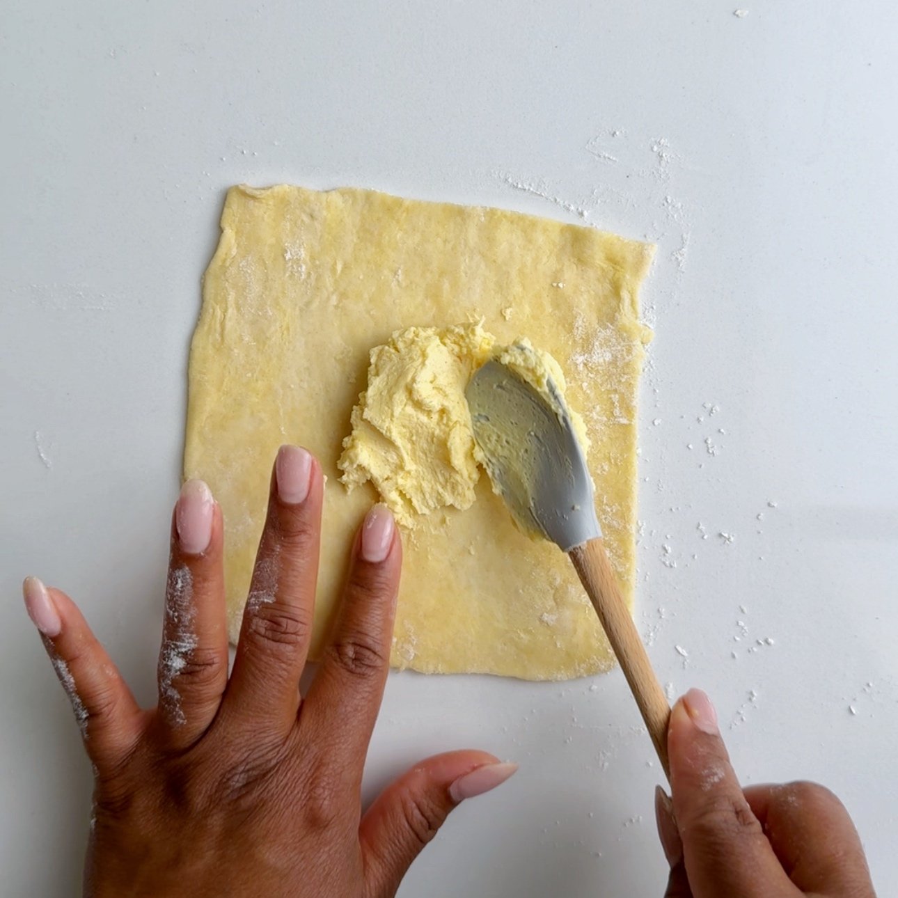 Adding the cheese filling to cheeserolls