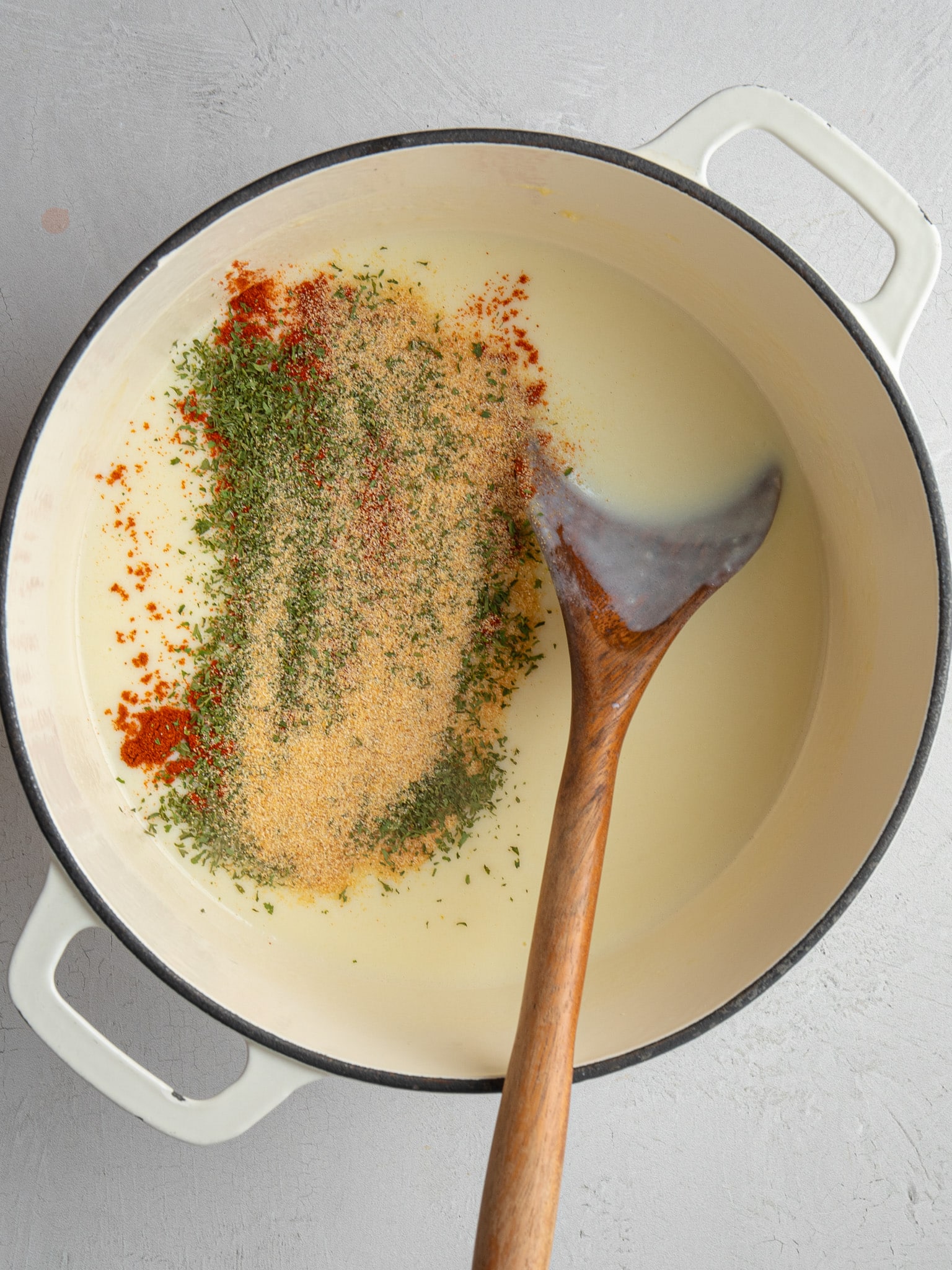 Garlic powder, onion powder, smoked paprika and parsley added to the sauce