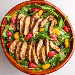 jerk chicken salad with berries and caramelized onion dressing