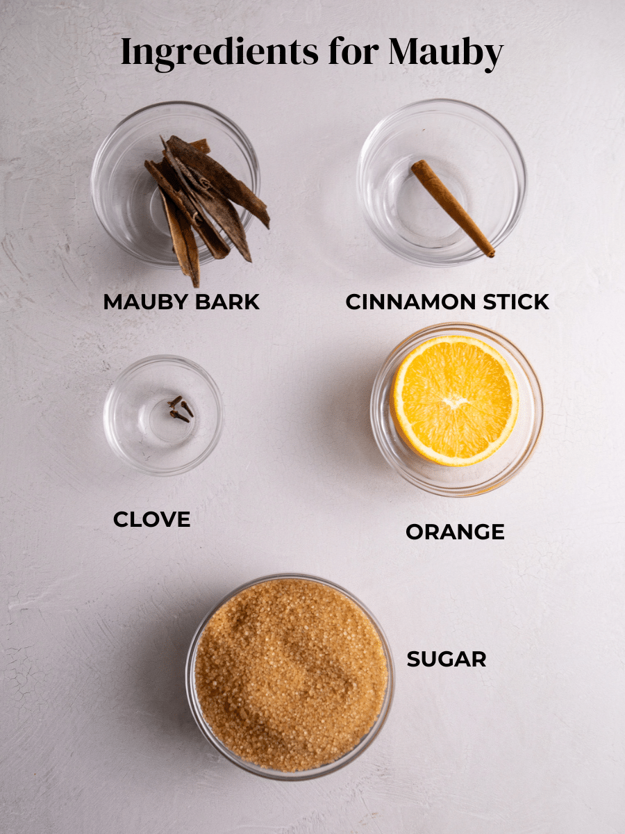 Ingredients for Mauby measured out and labeled: Mauby Bark, Cinnamon, Clove, Orange and sugar