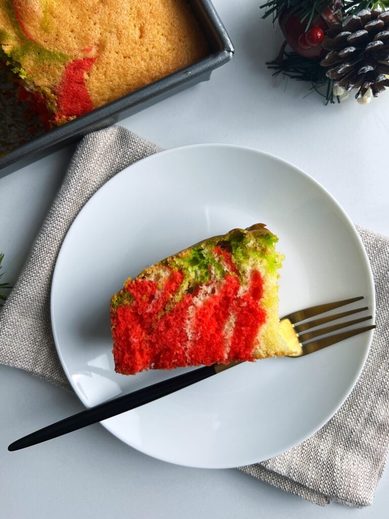 plated Guyanese sponge cake next to a pan full