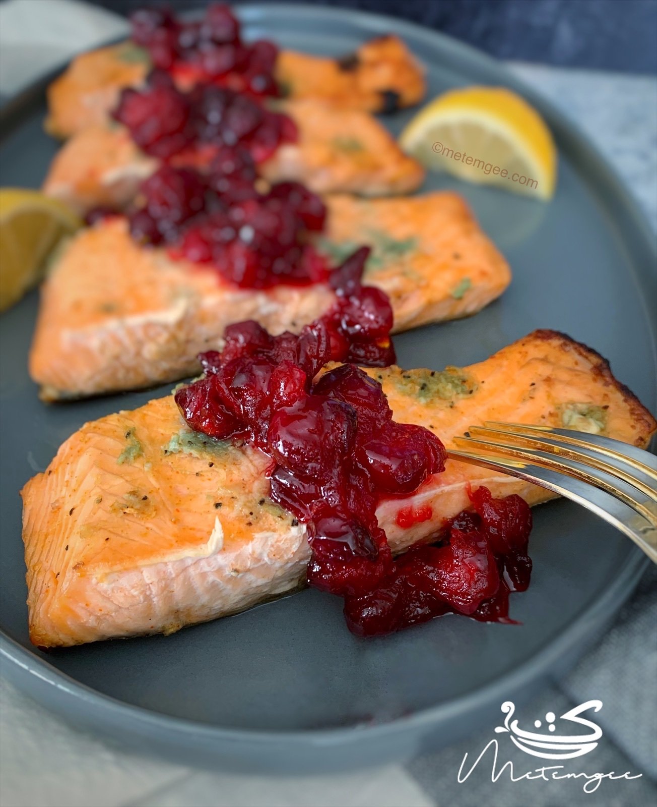 plated broiled salmon topped with chutney