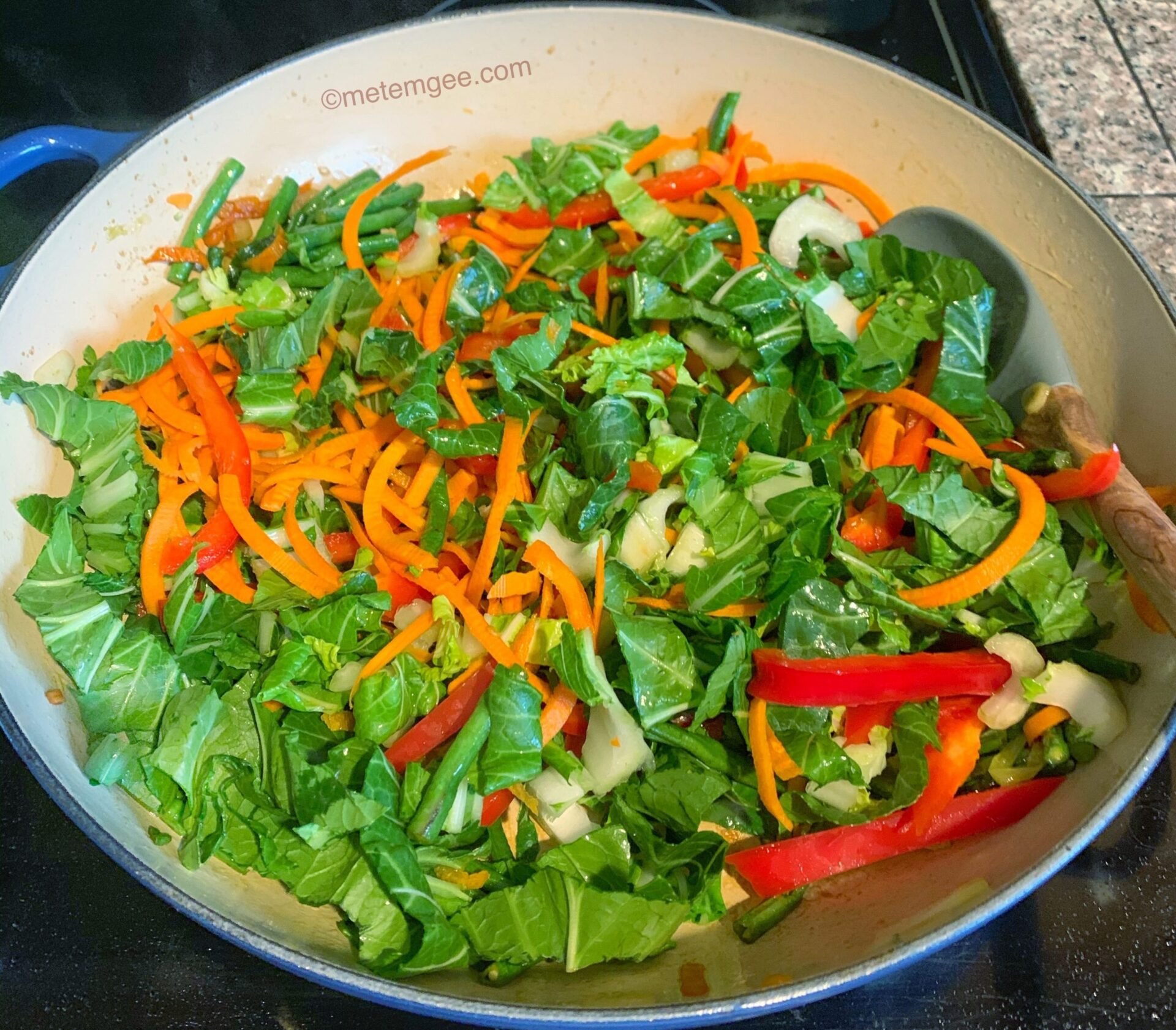 veggies sautéing in a pan