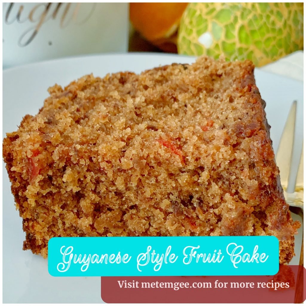 close up view of a plated slice of Guyanese fruit cake