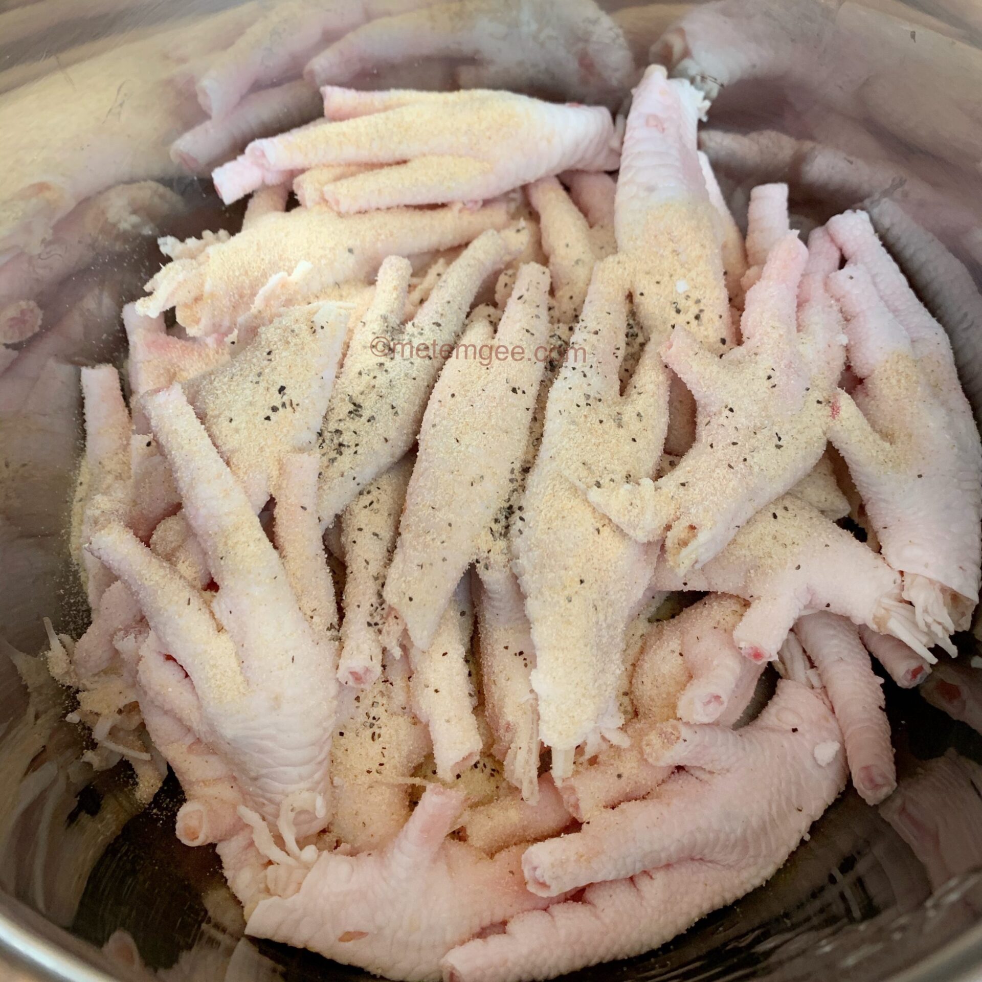 a bowl of cleaned, chopped, and seasoned chicken feet
