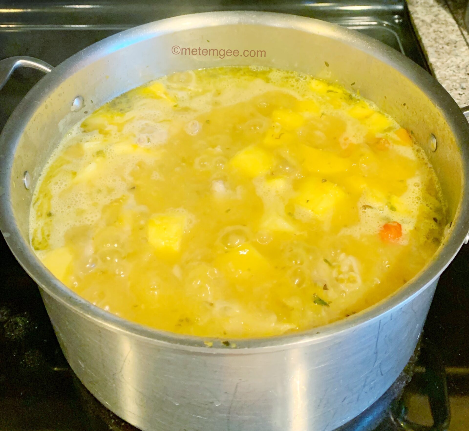 a bubbling pot of chicken feet soup