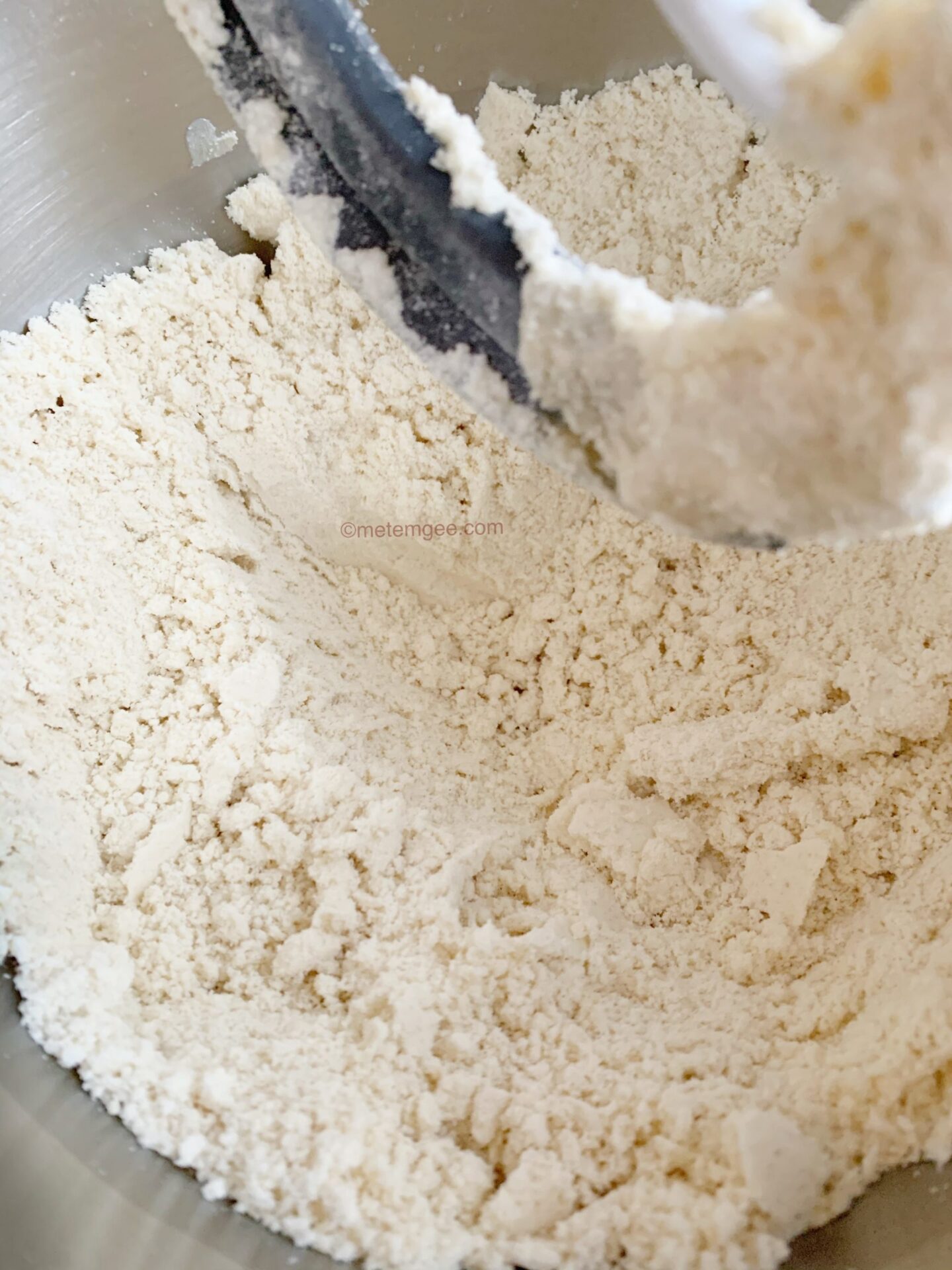 close up view of gluten free flours mixed with salt in a bowl