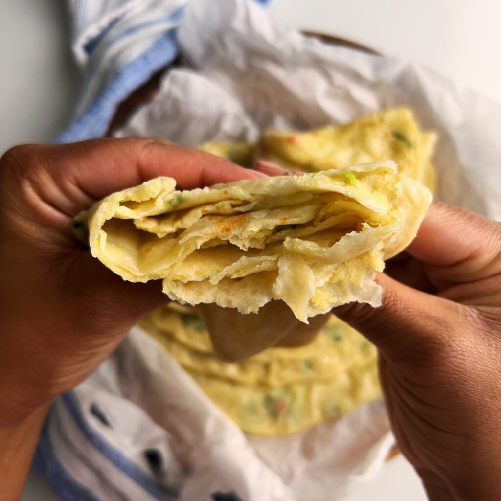 flaky layers of cooked potato roti