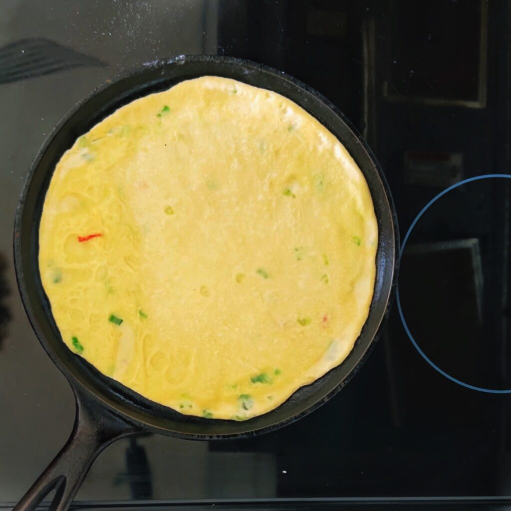 overhead view of aloo paratha in skillet