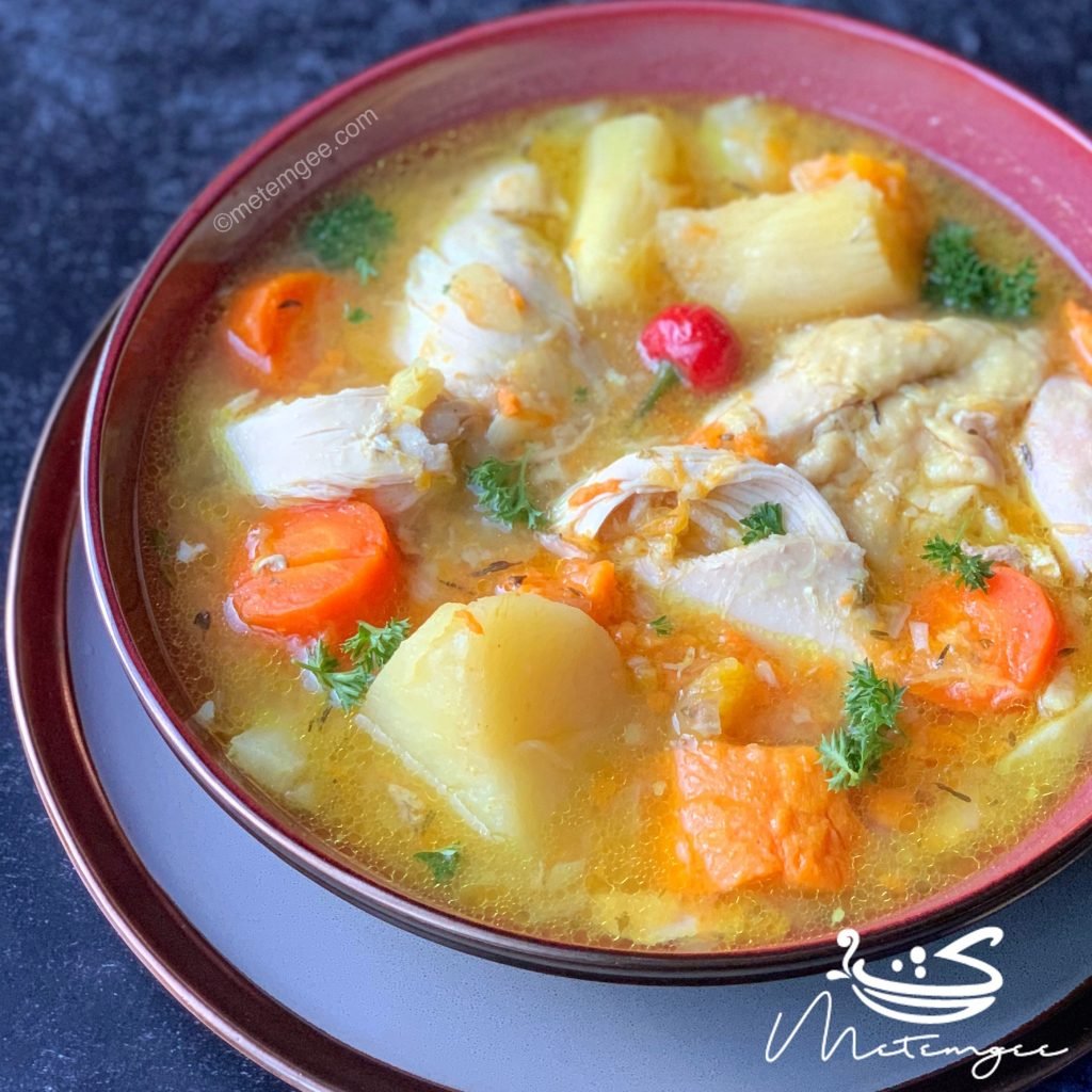 close up view of chicken and root vegetable soup in a bowl