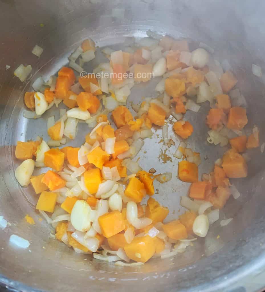 sautéing diced onions, garlic, and pumpkin