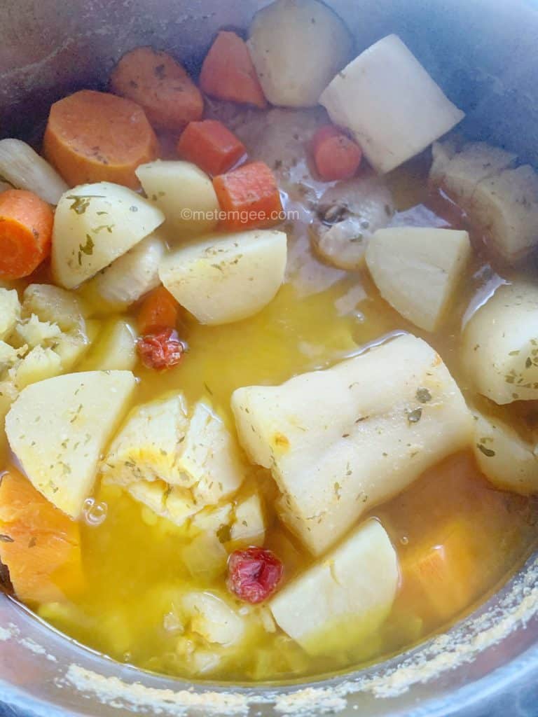 close up view of chicken and root vegetable soup in instant pot