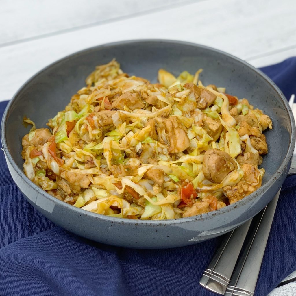 chicken and cabbage stir fry in a skillet