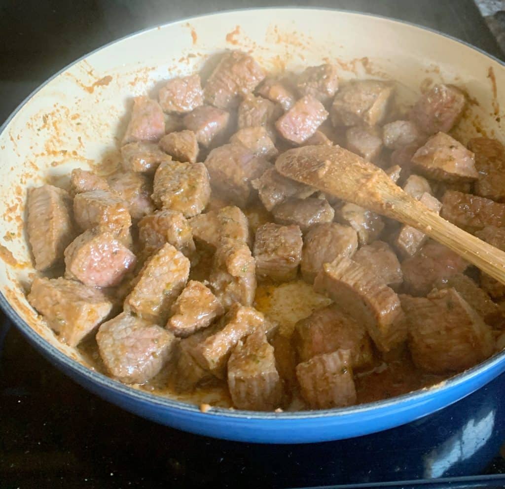 searing beef in a pan