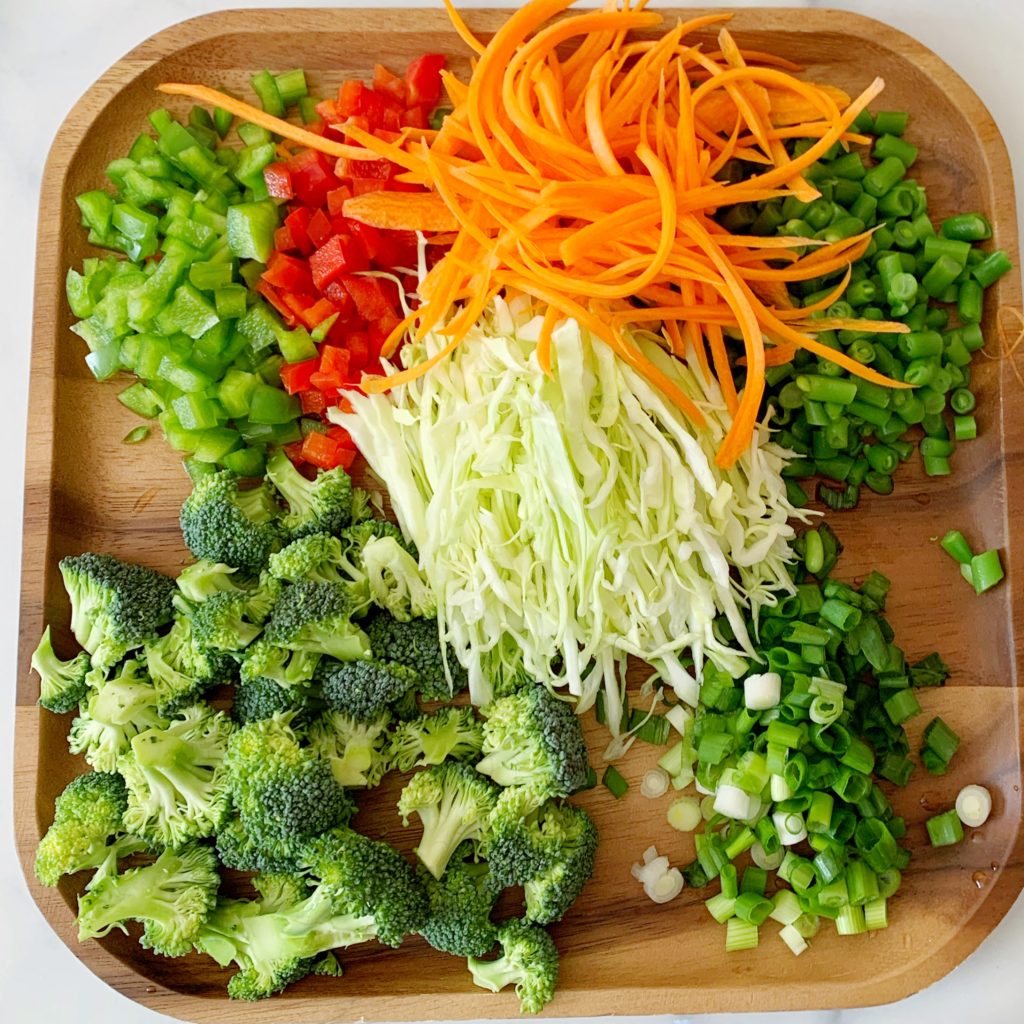 an array of fresh vegetables on a cutting board