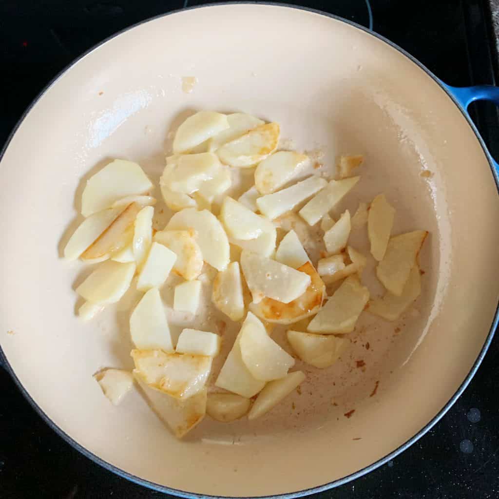 potato slices in a skillet