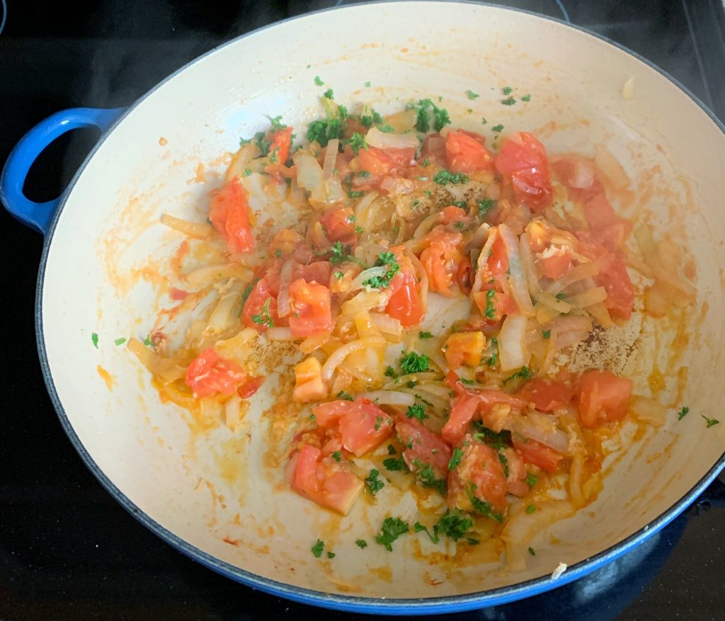 veggies sautéing in a pan