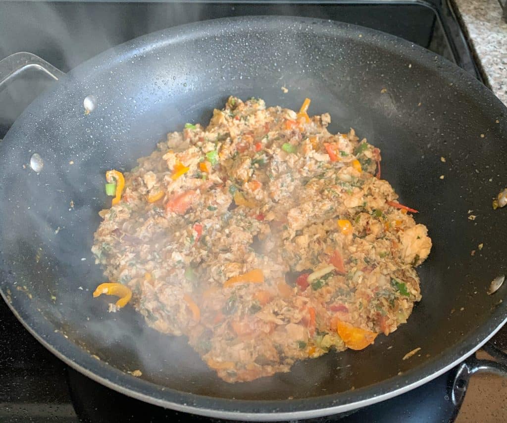 sautéed canned salmon in a wok