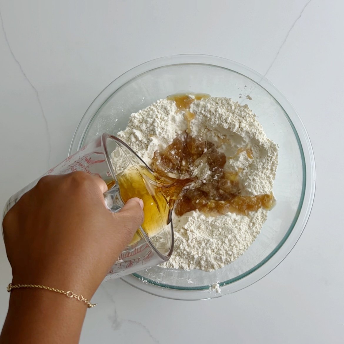 forming a well in the center of the flour mixture