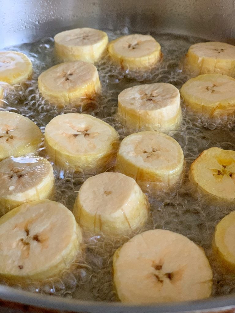 plantains frying in a skillet