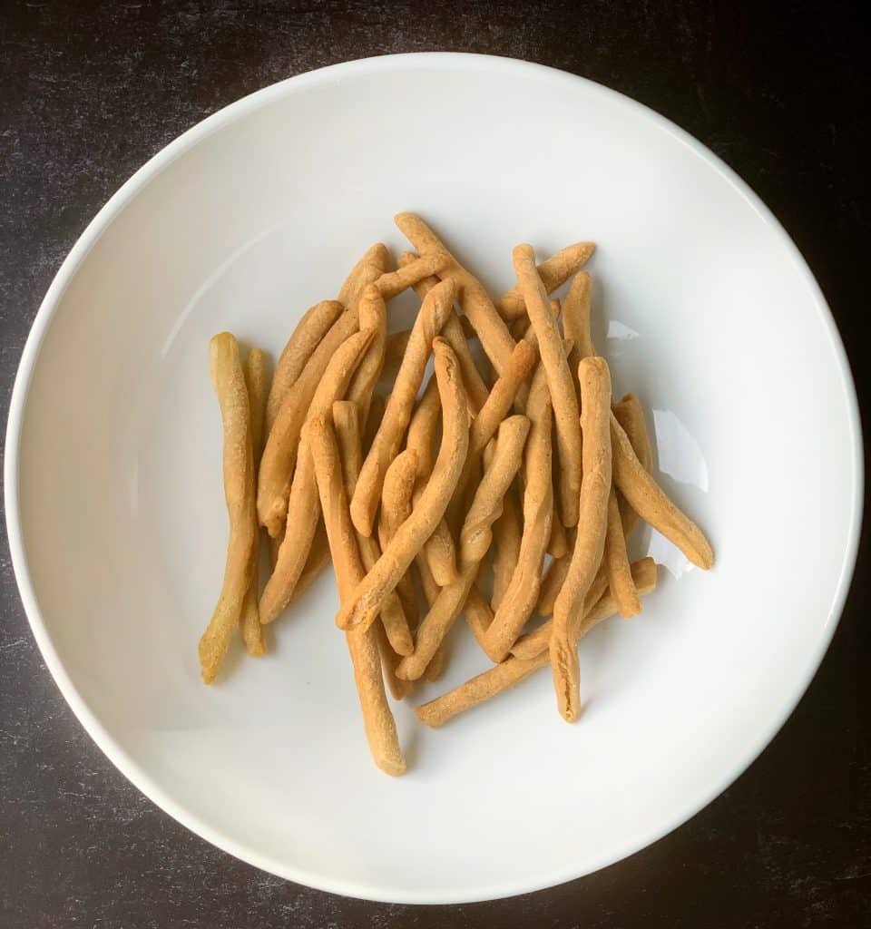 fried mithai in a bowl before being coated with sugar