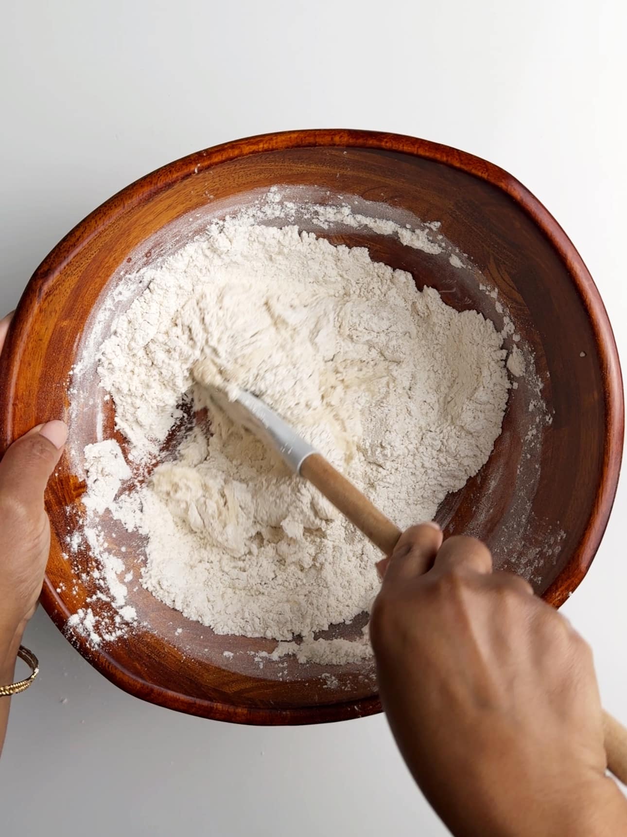 Mixing the ingredients with a spatula.
