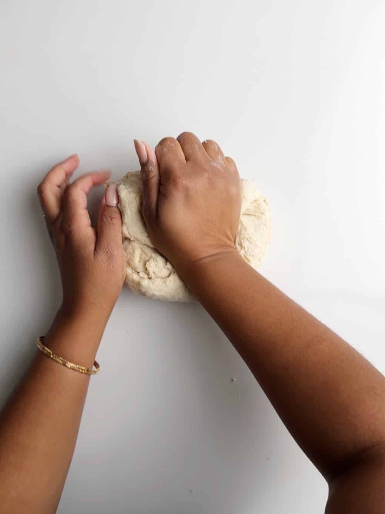 Kneading dough on a floured surface