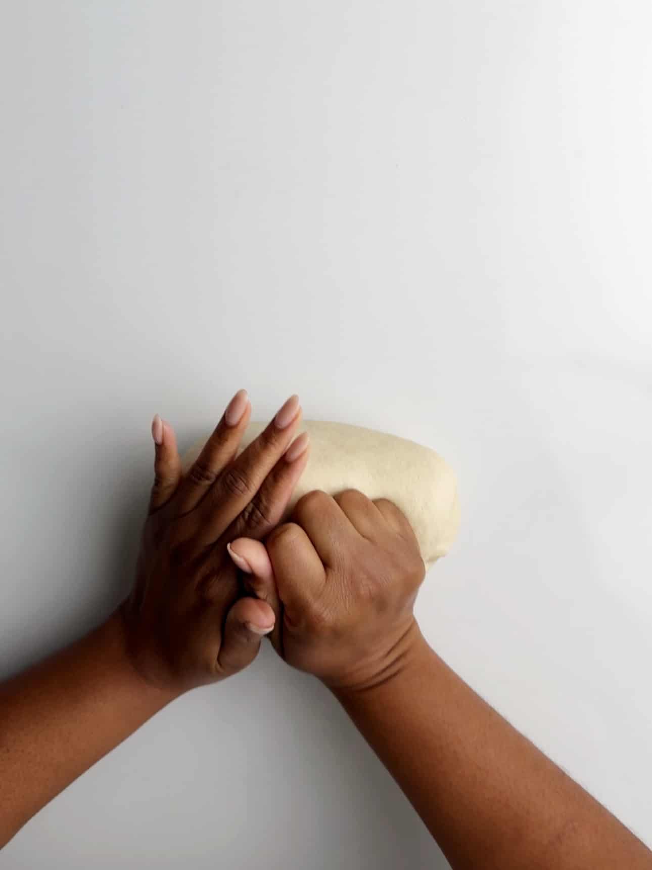 Kneading dough to make a smooth ball