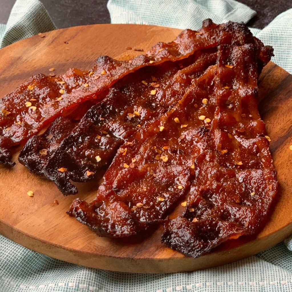 teriyaki glazed bacon topped with red pepper flakes