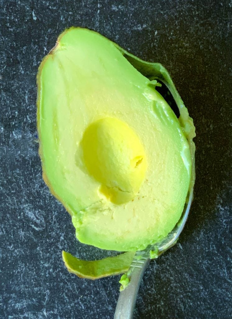 sliced avocado with the pit removed