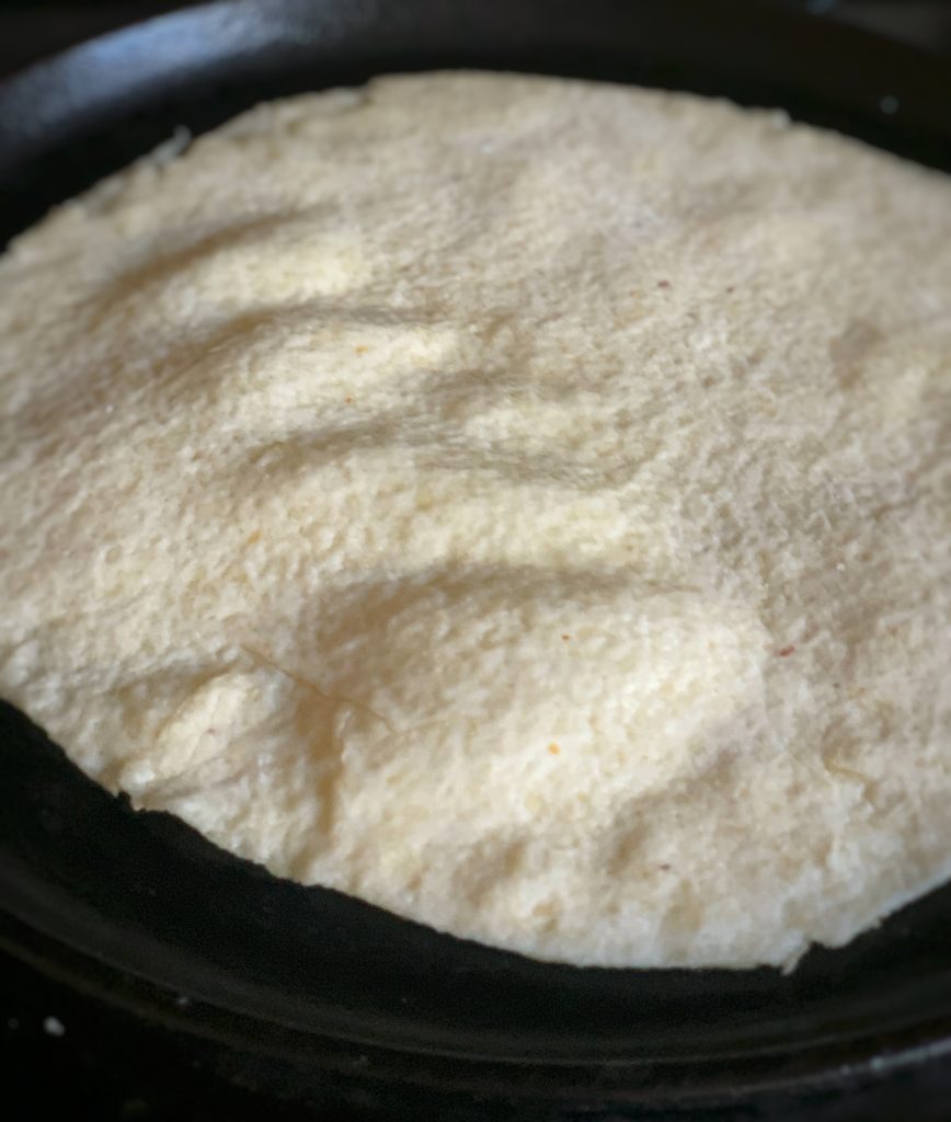 roti cooking on a flat surface