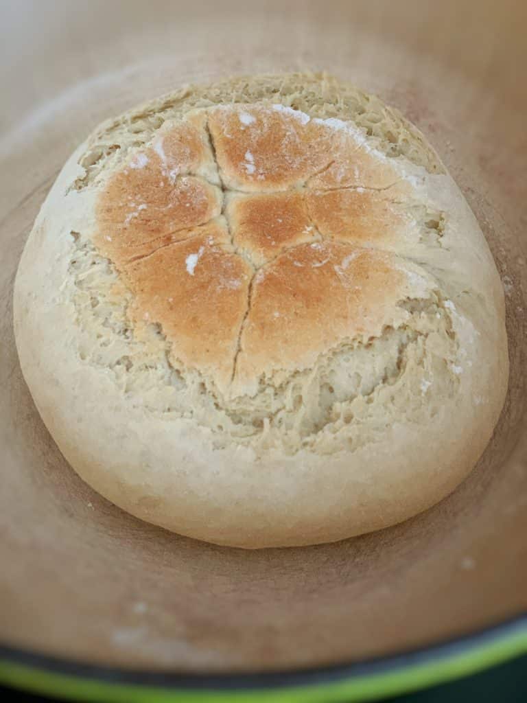 close up view of pot bread in a dutch oven 